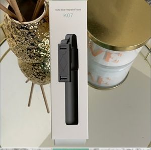 Selfie stick integrated tripod